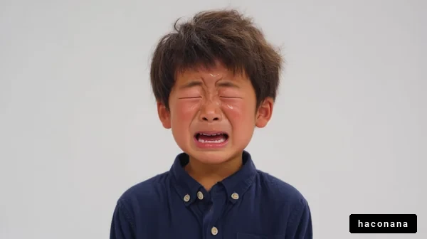 涙を流す少年の表情
